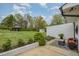Charming backyard with lush lawn, beautiful landscaping, gazebo, and outdoor seating area at 5121 Leesville Rd, Durham, NC 27703