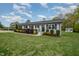 Attractive one-story home featuring manicured landscaping and a well-maintained lawn at 5121 Leesville Rd, Durham, NC 27703
