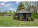 Charming gazebo surrounded by lush greenery offers a serene outdoor retreat at 5121 Leesville Rd, Durham, NC 27703