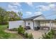 Well-maintained rear exterior with cozy patio space, garden area, and covered parking at 5121 Leesville Rd, Durham, NC 27703