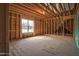 Unfinished attic showing roof-line with beams and construction materials, offering potential for customization and expansion at 55 Glasgow, Rocky Mount, NC 27804