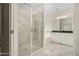 Bathroom shower with marble tile, glass doors, and a pebble tile floor adjacent to a tub at 55 Glasgow, Rocky Mount, NC 27804