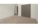 Bedroom with neutral carpet and a double door closet at 55 Glasgow, Rocky Mount, NC 27804