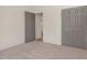 Bedroom with neutral carpet and a closet behind grey double doors at 55 Glasgow, Rocky Mount, NC 27804