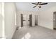 Spacious bedroom with neutral carpet, ceiling fan, and ensuite bathroom and walk-in closet access at 55 Glasgow, Rocky Mount, NC 27804