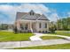 Charming single-story brick home with a welcoming front porch and well-manicured lawn on a sunny day at 55 Glasgow, Rocky Mount, NC 27804