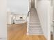 Foyer with hardwood floors and a staircase leading to an open-concept kitchen at 55 Glasgow, Rocky Mount, NC 27804