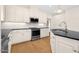 Modern kitchen showcasing stainless steel appliances, granite countertops, white cabinets, and wood floors at 55 Glasgow, Rocky Mount, NC 27804