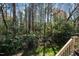 Enjoy nature from the deck overlooking the lush, mature trees in the peaceful backyard at 5932 Whitebud Dr, Raleigh, NC 27609