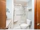 Bathroom boasts a glass-enclosed shower, white toilet, and a vanity with light countertop at 5932 Whitebud Dr, Raleigh, NC 27609