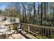 Relaxing outdoor deck with comfortable seating and serene views of mature trees at 5932 Whitebud Dr, Raleigh, NC 27609