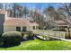 Charming home with well-manicured lawn and landscape and wooden access bridge at 5932 Whitebud Dr, Raleigh, NC 27609