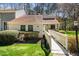 Inviting home with a well-maintained lawn and a quaint walkway leading to the front door, perfect for curb appeal at 5932 Whitebud Dr, Raleigh, NC 27609