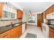 Functional kitchen with updated appliances, granite countertops, and ample cabinet space, creating a welcoming space for cooking at 5932 Whitebud Dr, Raleigh, NC 27609