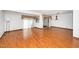 Bright living room with hardwood floors, a large window, and access to the dining area at 5932 Whitebud Dr, Raleigh, NC 27609