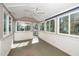 Bright sunroom featuring large windows and a ceiling fan for year-round enjoyment at 5932 Whitebud Dr, Raleigh, NC 27609