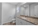 Bathroom features granite countertops, white cabinets, and modern fixtures at 65 Crow Field St, Roxboro, NC 27574