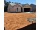 New construction home featuring a two-car garage and a spacious yard at 65 Crow Field St, Roxboro, NC 27574