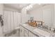 Bathroom with double vanity and granite countertops at 6926 Leesville Rd, Raleigh, NC 27613