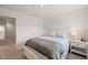 Carpeted bedroom with neutral paint and a glimpse of the hallway at 6926 Leesville Rd, Raleigh, NC 27613