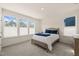 Bright bedroom with plush carpet and large windows providing natural light at 6926 Leesville Rd, Raleigh, NC 27613