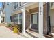 Charming brick facade with a gray front door and well-maintained landscaping at 6926 Leesville Rd, Raleigh, NC 27613