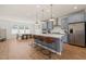 Stylish kitchen with a large center island and stainless steel appliances at 6926 Leesville Rd, Raleigh, NC 27613