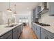 Modern kitchen featuring stainless steel appliances and a subway tile backsplash at 6926 Leesville Rd, Raleigh, NC 27613
