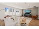 Bright living room with large windows, hardwood floors, and stylish decor at 6926 Leesville Rd, Raleigh, NC 27613