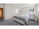 Bright main bedroom with soft carpet, a serene aesthetic, and plenty of natural light at 6926 Leesville Rd, Raleigh, NC 27613