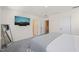 Bright main bedroom with soft carpet, TV, and plenty of natural light at 6926 Leesville Rd, Raleigh, NC 27613
