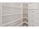 Walk-in closet with custom shelving, drawers, and hanging rods, ideal for organizing clothes at 6926 Leesville Rd, Raleigh, NC 27613