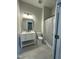 Modern bathroom with a sleek vanity, updated fixtures, and a shower with a neutral-toned curtain at 6932 Buckhorn Duncan Rd, Holly Springs, NC 27540