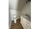 Stylish half bath with vanity and marble countertop at 6932 Buckhorn Duncan Rd, Holly Springs, NC 27540