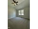 Spacious bedroom featuring vaulted ceilings, plush carpet, and large double windows at 6932 Buckhorn Duncan Rd, Holly Springs, NC 27540