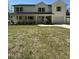 Charming two-story home with a welcoming front porch, natural wood shutters, and landscaped yard at 6932 Buckhorn Duncan Rd, Holly Springs, NC 27540