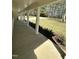 View of front porch featuring landscaping, white columns, and a concrete floor at 6932 Buckhorn Duncan Rd, Holly Springs, NC 27540