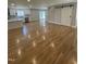 Open-concept living area with modern sliding barn door and views of the stylish kitchen at 6932 Buckhorn Duncan Rd, Holly Springs, NC 27540