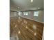 Open living room featuring hardwood floors, recessed lighting, and lots of natural light at 6932 Buckhorn Duncan Rd, Holly Springs, NC 27540