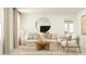 Bright living room with stylish furniture, a round mirror accent, and a welcoming atmosphere for relaxation at 716 Shea Hill Dr # 50, Angier, NC 27501