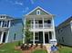 Two-story home with a charming front porch and manicured landscaping for curb appeal at 732 Georgia'S Landing Pkwy # 8, Raleigh, NC 27603