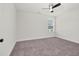 Bedroom with carpet, ceiling fan, window, and neutral walls at 75 Eltham, Rocky Mount, NC 27804