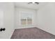 This bedroom features neutral paint, carpeting, and a window with blinds for natural light at 75 Eltham, Rocky Mount, NC 27804