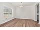 Bright dining room features hardwood floors, a large window, and a stylish light fixture at 75 Eltham, Rocky Mount, NC 27804