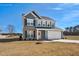 Charming two-story home with a mix of siding, brick, and beautiful curb appeal at 75 Eltham, Rocky Mount, NC 27804