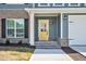 Inviting front entrance with a bright yellow door, classic black hardware, and complementary gray and brick accents at 75 Eltham, Rocky Mount, NC 27804