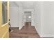 Inviting hallway featuring hardwood floors, neutral paint, and open floor plan at 75 Eltham, Rocky Mount, NC 27804