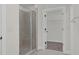 Walk-in shower with a seat, frameless door, and tile walls and flooring at 75 Eltham, Rocky Mount, NC 27804