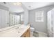 Bathroom featuring a vanity, toilet, large mirror, and shower curtain at 7707 Oak Marsh Dr, Raleigh, NC 27616