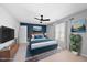 Comfortable bedroom featuring a fan, stylish furnishings and a vibrant accent wall at 7707 Oak Marsh Dr, Raleigh, NC 27616